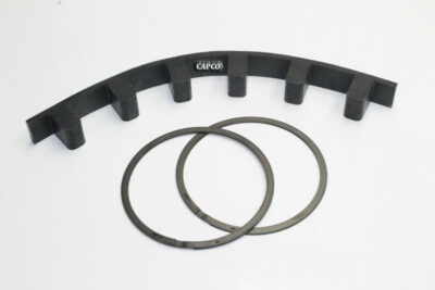 Replacement 045672 Sullair coupling drive element laying next to two circular gaskets.