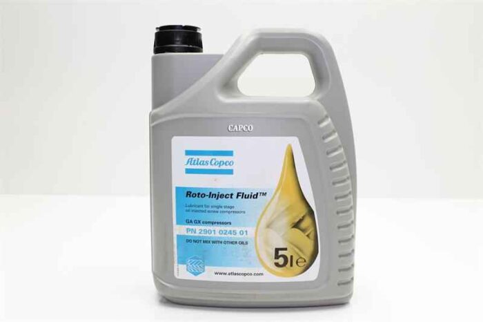 Image of a gray 5-liter case of Atlas Copco Roto Inject fluid sitting on a white surface in front of a blank background.