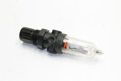 Image of a 4ZK74 Speedaire filter regulator for Grainger compressors laying on its side.